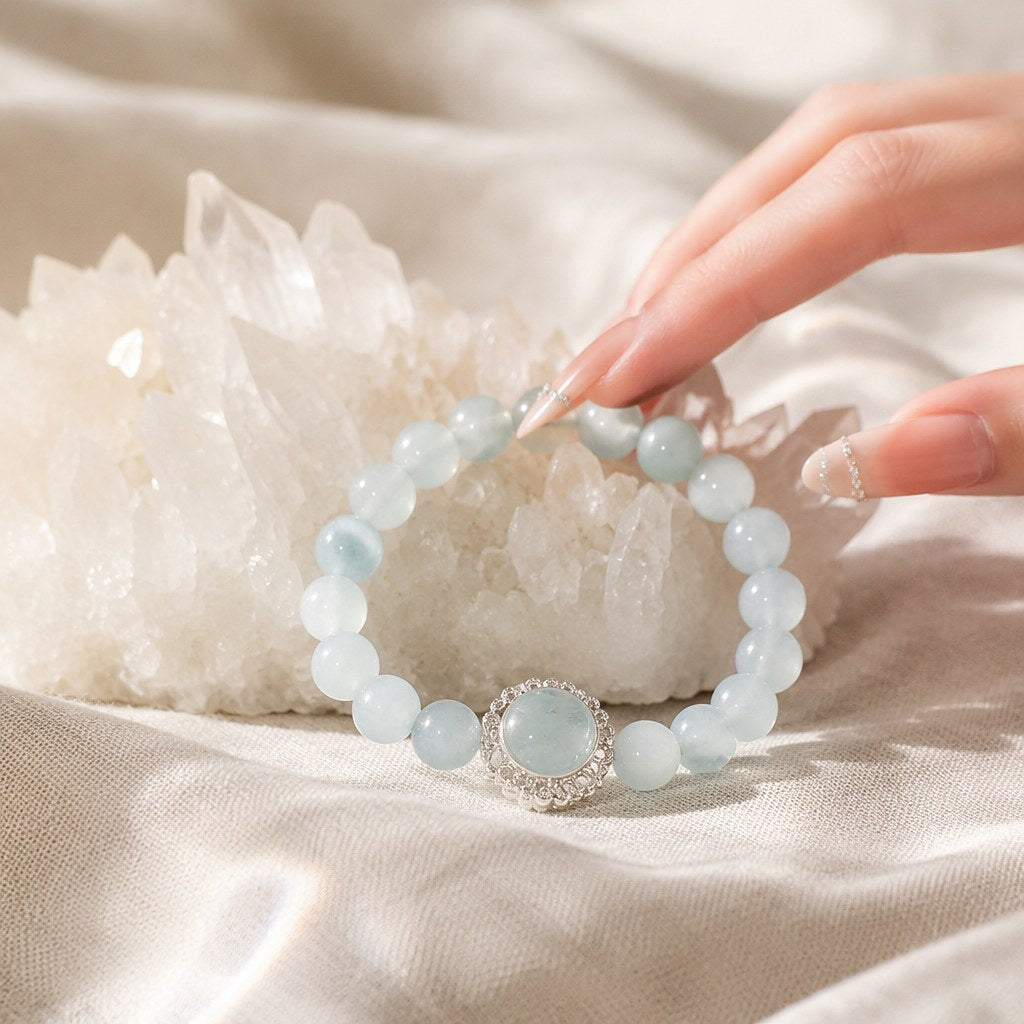 Ocean's Whisper pale blue aquamarine beaded stretch bracelet with silver-tone pave halo charm