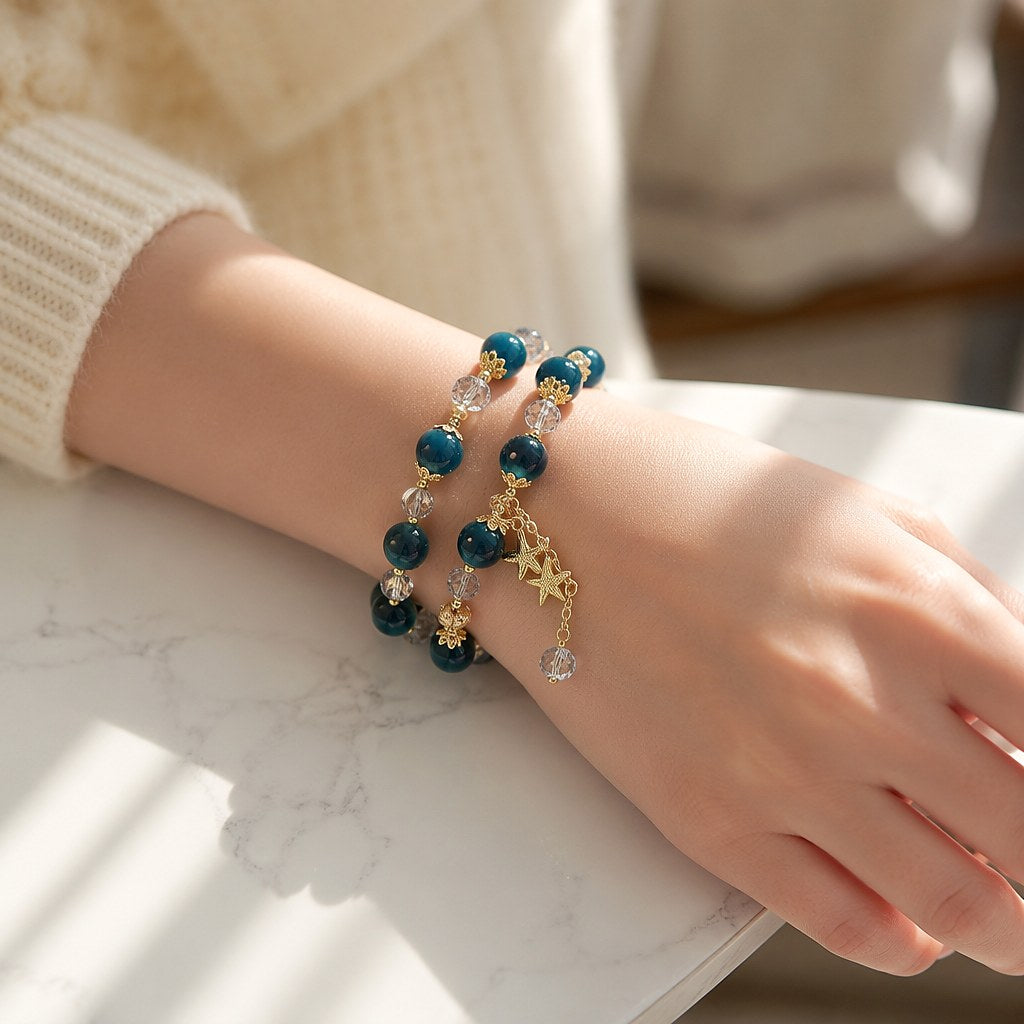 Starlit Azure Wrap double-wrap bracelet with chatoyant deep teal blue tiger's eye beads, faceted clear crystal rondelles