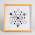 Light natural wood framed Metatron's Cube crystal grid with a carved faceted amethyst star centerpiece, navy lapis lazul