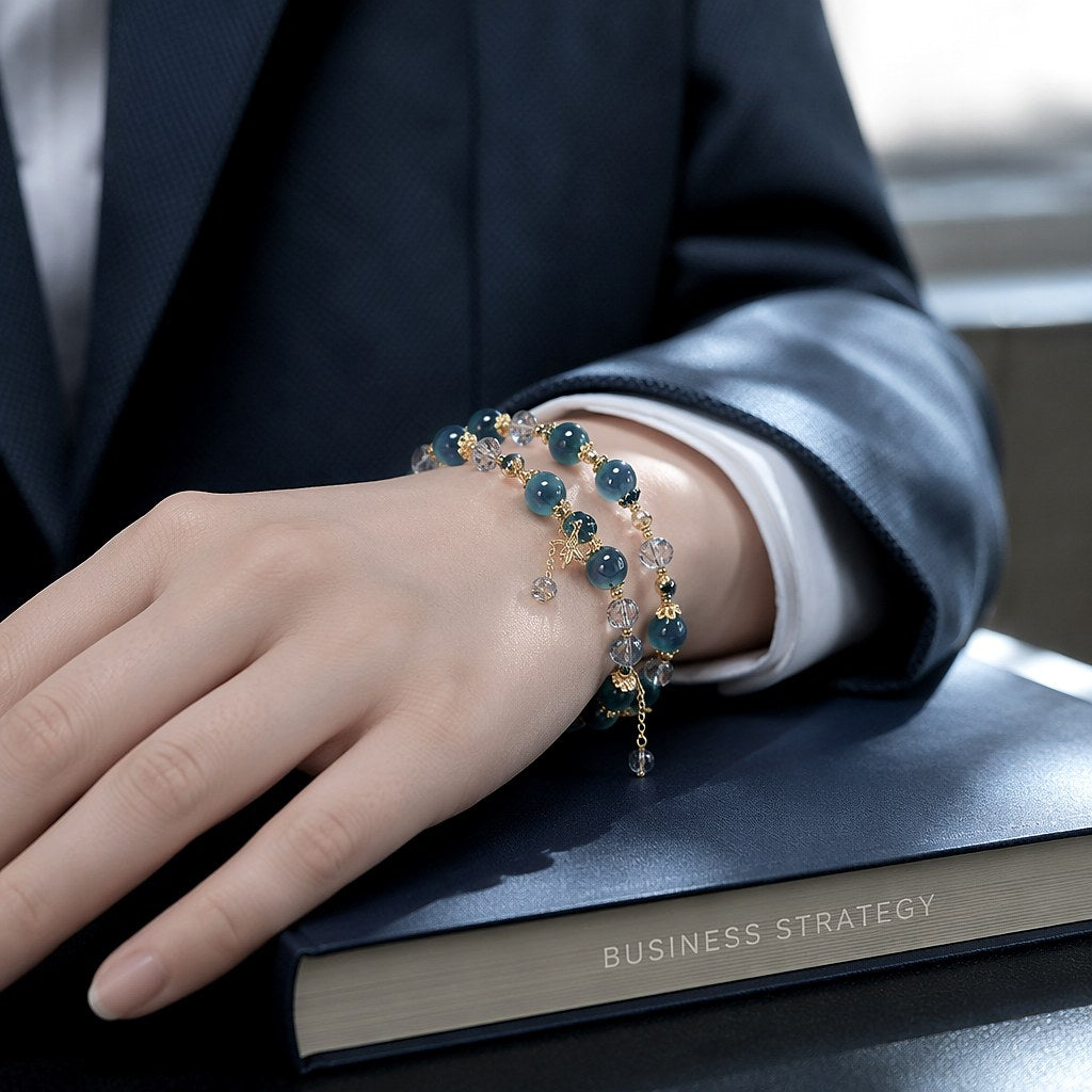 Starlit Azure Wrap double-wrap bracelet with chatoyant deep teal blue tiger's eye beads, faceted clear crystal rondelles
