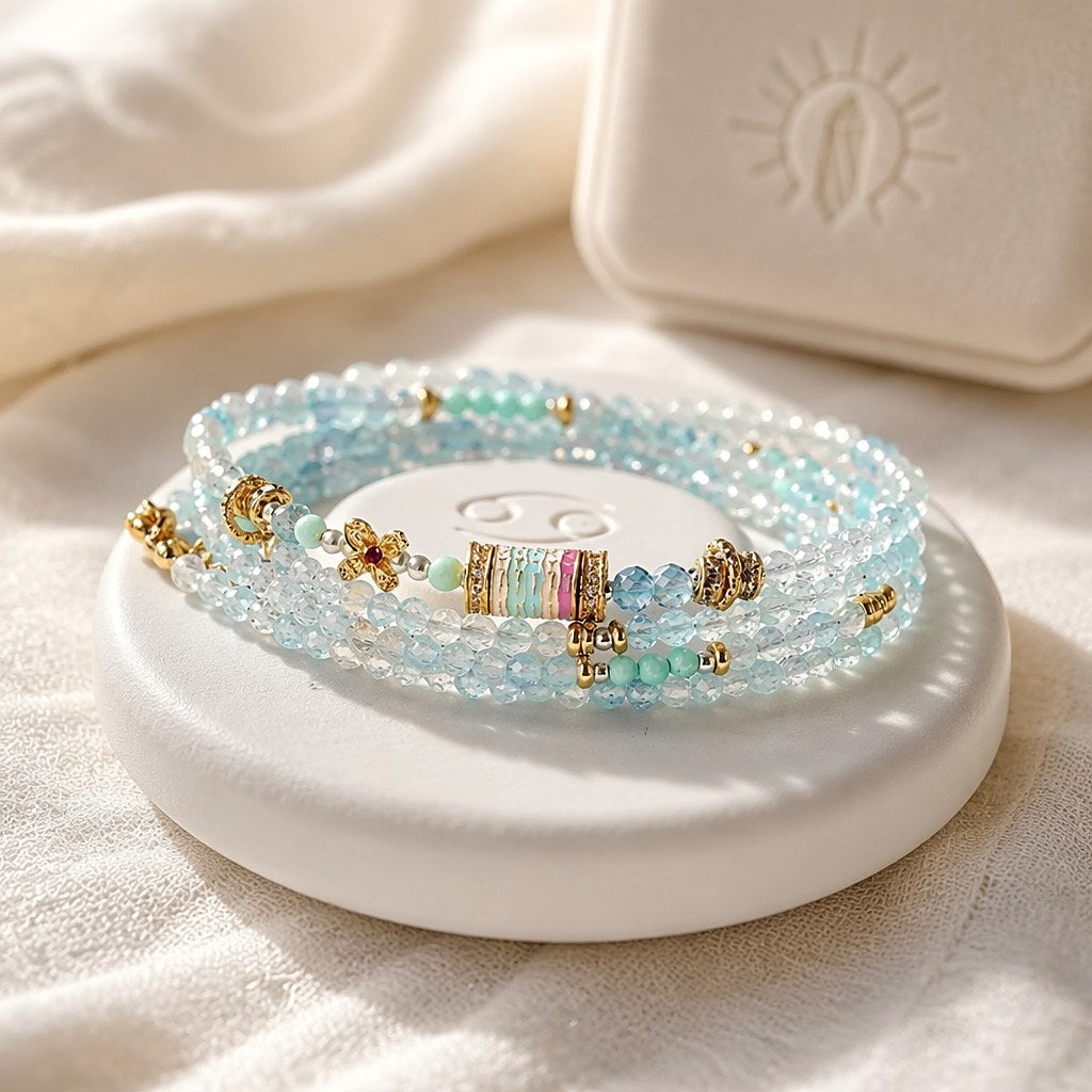 Cancer zodiac triple-wrap bracelet in 3mm faceted aquamarine with turquoise accents, five-color enamel barrel bead, gold