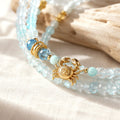 Cancer zodiac triple-wrap bracelet in 3mm faceted aquamarine with turquoise accents, five-color enamel barrel bead, gold
