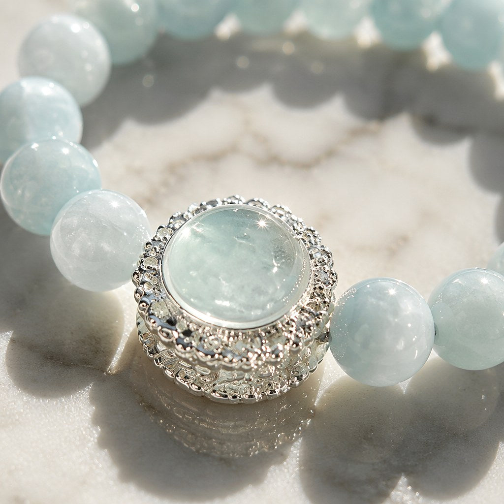 Ocean's Whisper pale blue aquamarine beaded stretch bracelet with silver-tone pave halo charm