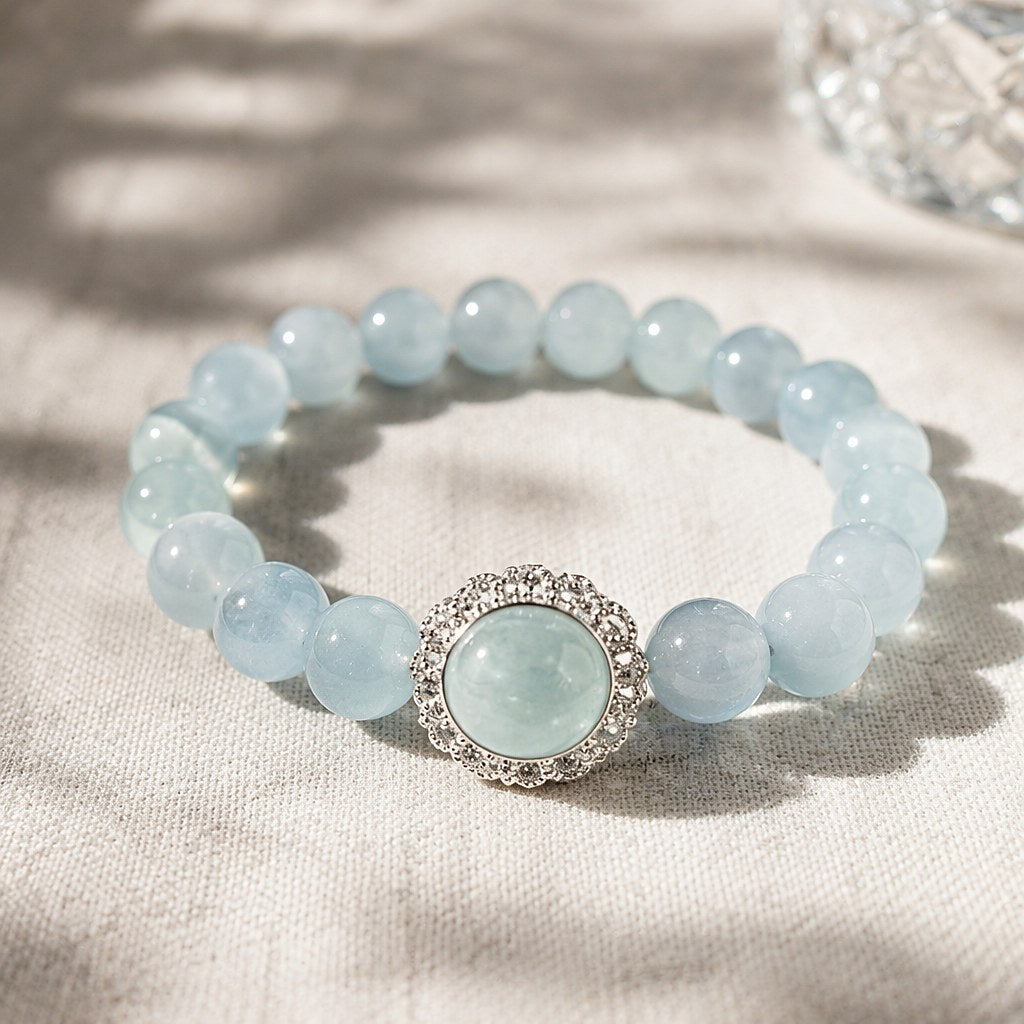 Ocean's Whisper pale blue aquamarine beaded stretch bracelet with silver-tone pave halo charm
