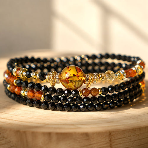Capricorn zodiac triple-wrap bracelet with faceted black tourmaline beads, flower amber statement bead, citrine accents,