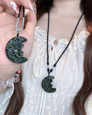 Obsidian crescent fox pendant necklace, front view