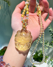 Yellow carved fox pendant necklace, front view