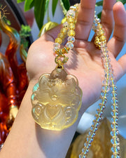 Yellow carved fox pendant necklace, view 4