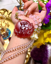 Red-pink carved fox pendant necklace, alternate view